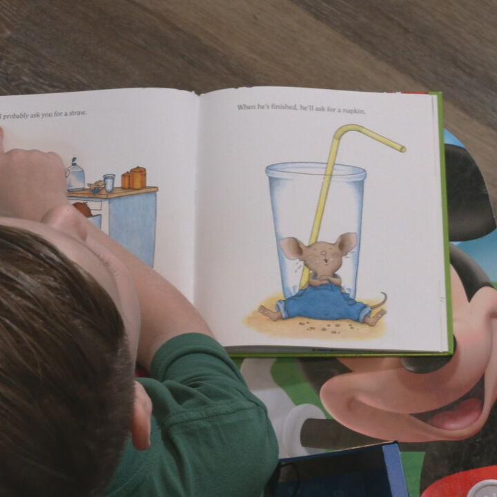 Child reads from story book
